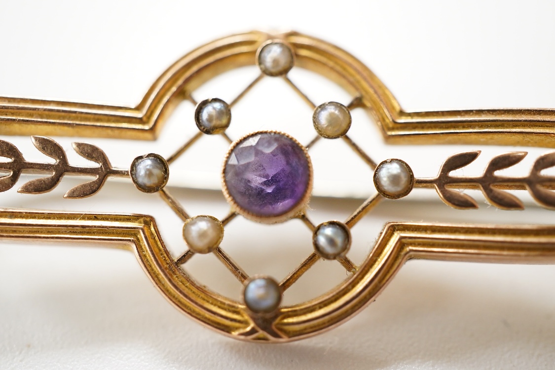 A Victorian 15ct and diamond set navette shaped Etruscan style brooch (lacking pin), 46mm, gross weight 3.5 grams, a 9ct, amethyst and seed pearl set bar brooch and a 9ct, garnet and split pearl set wreath brooch, gross